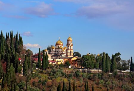 Old monastery on top of a hill among cypressesの写真素材