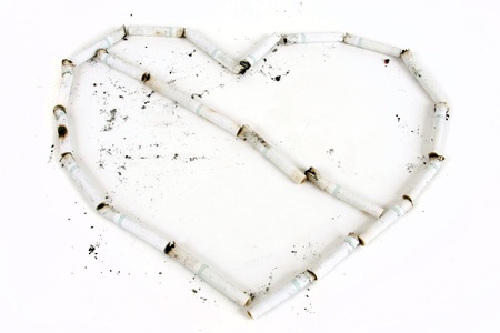 Cigaretts form a heart with a line through it.の写真素材