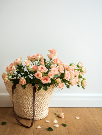 ECO-friendly shopping bag woven with roses on the floor.の写真素材