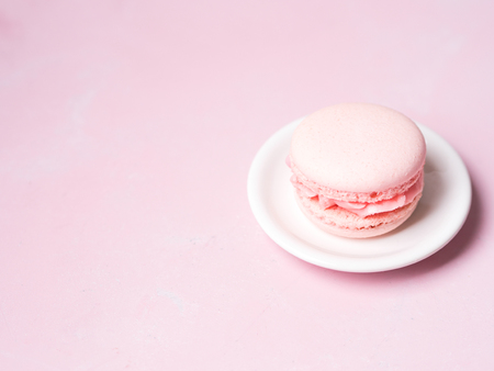 Pink colorful cake macaroon on pastel background, colorful almond cookiesの写真素材