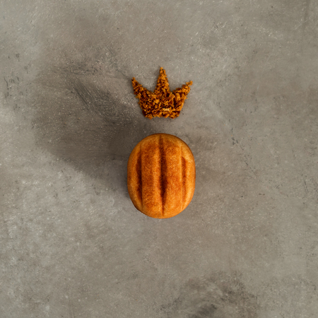 Close view of one cookie in the shape of walnut with condensed milk on concrete backgroundの写真素材