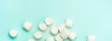 ?lose-up of marshmallow on turquoise background. wide bannerの写真素材