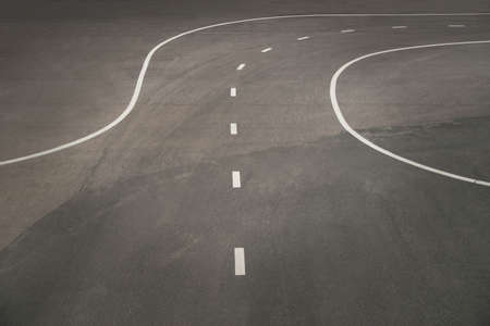 White road markings on asphaltの写真素材