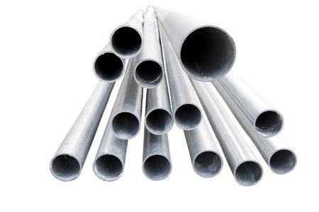 Heap of metal pipes isolated on white