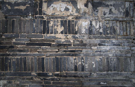 Close up of lack grungy brick wallの写真素材