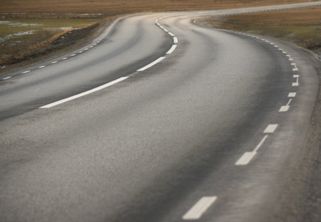 Winding asphalt road in rural area
