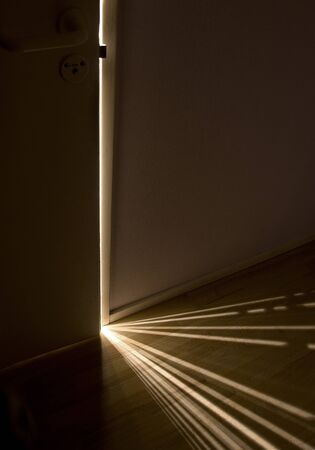 sun beams under doorの写真素材