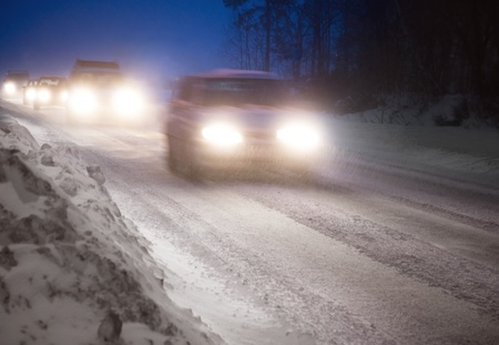 Heavy traffic on a country road in a winter eveningの写真素材