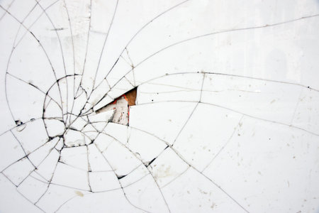 Cracked white tile with a piece missing