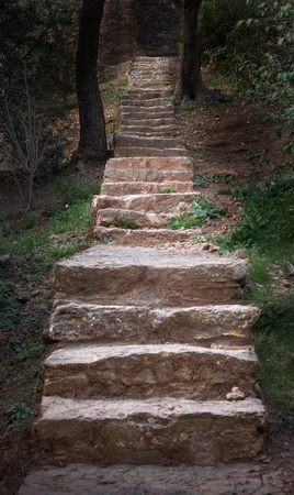 Stone staircase diminishing into the darkの写真素材
