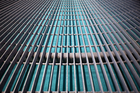 Metal grid on a turquoise background