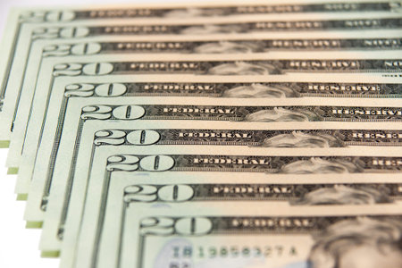 Close up of stack lof twenty dollar notes