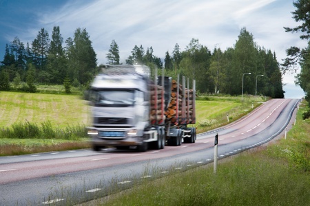Truck with timber on rural country roadのeditorial素材