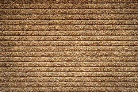 Background of plastered concrete wall with regular patternの写真素材