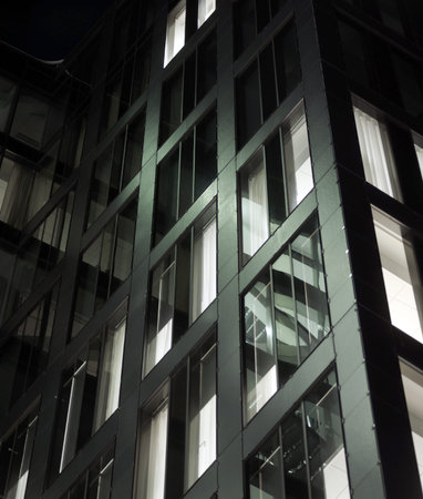 Facade of modern office building in evening