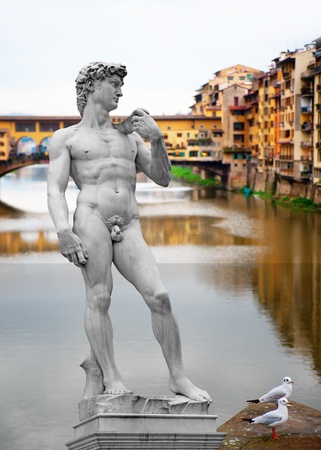 Design with famous landmarks in Florence, italy - The statue of David and Ponte Vecchio on river Arnoの写真素材