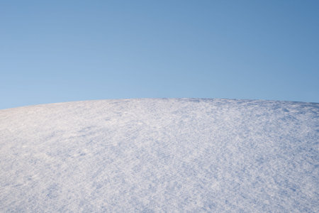 Simple background of winter landscape with blue clear sky