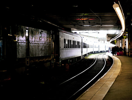 People waiting for a train at a railway stationの写真素材