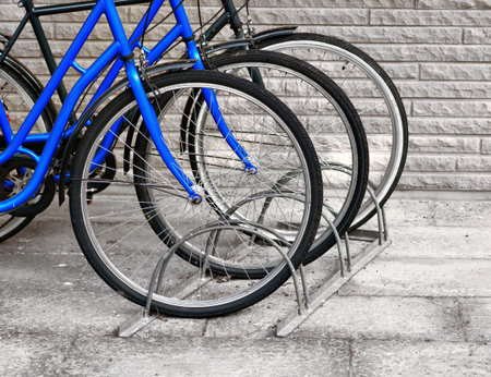 Front wheels of three bicycles in a row