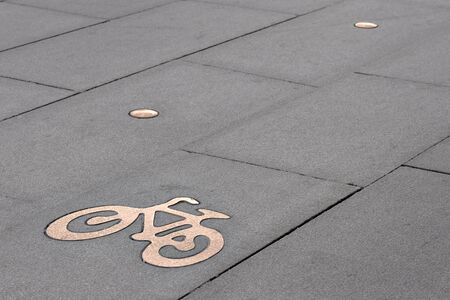 Bicycle symbol on bicycle path on pavementの写真素材