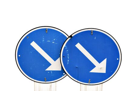 Two blue road signs with white arrows isolated on whiteの写真素材
