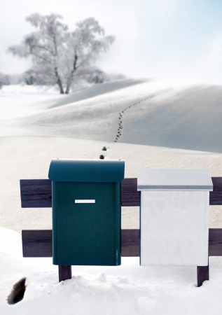 Mailboxes and footprints in snow in remote areaの写真素材