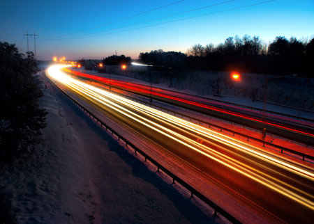 Evening traffic on highway with streaks of light
