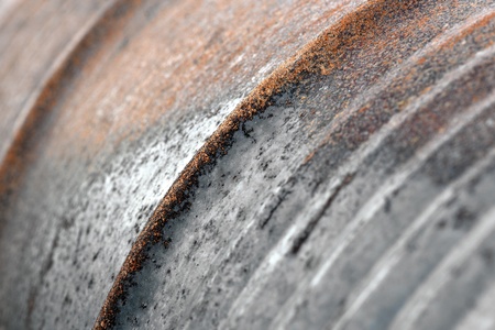 Close up of rough surface of rusty oil barrelの写真素材