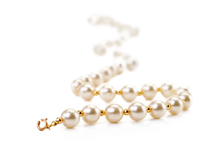 Close up of pearl necklace isolated on whiteの写真素材