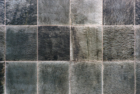 Background with rough textured tiles of rock