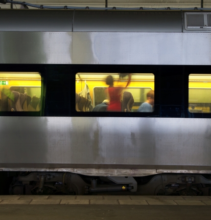 Train with passengers getting ready for departureのeditorial素材