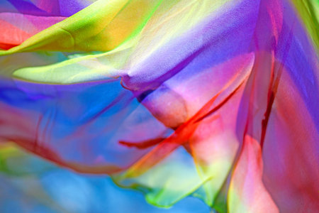 Colorful background with piece of fabric blowing in the wind