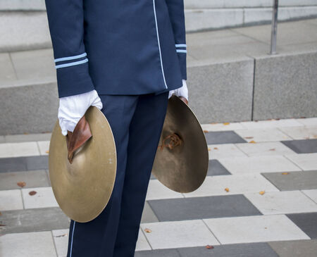 Young man with two cymbals in marching bandの写真素材