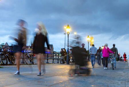 People strolling on late summer evening in Stockholmの写真素材