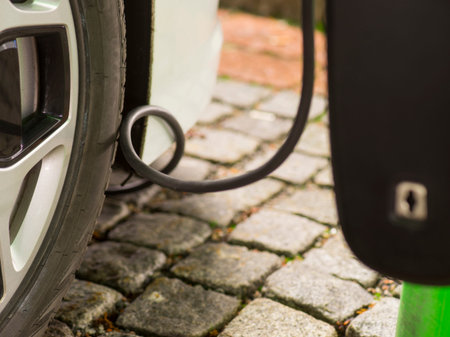 Close up of cable used to charge electric or hybrid car from public power supply
