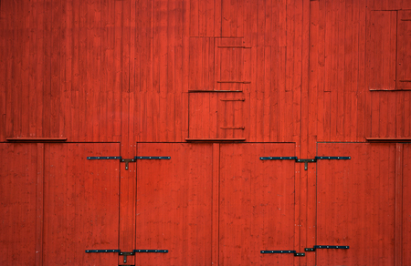 background with red wooden wall with metal detailsの写真素材