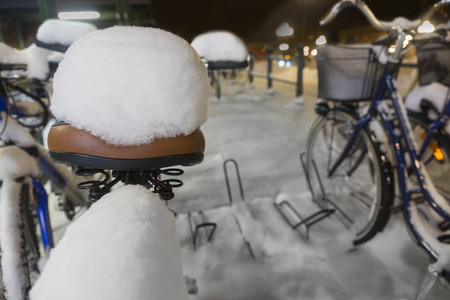 Bicycle seat with heap of snowの写真素材