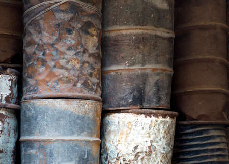 Heap of rusty oil barrelsの写真素材