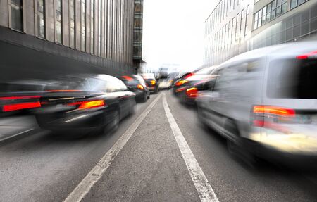 Busy urban traffic with merging lanes in blurred motionの写真素材