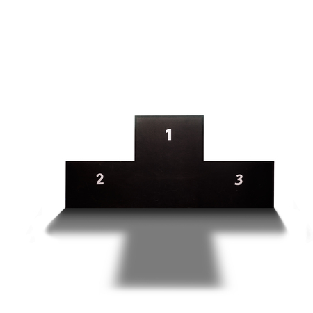 Back lit podium casting shadow in sports arenaの写真素材