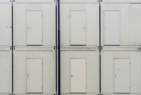 doors of stacked huts on construction site