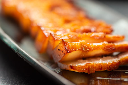 Delicious Chinese Sichuan braised pork dish made with soy sauce, sugar, chili sauce, star anise, cumin and other spicesの写真素材