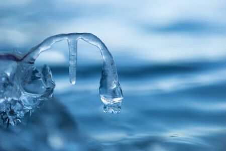 Icicle with beautiful shape formed by nature in waterの写真素材