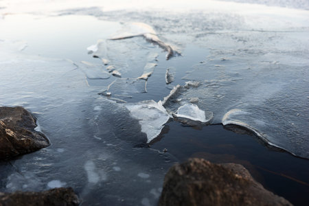 Coastline with cracking ice in early spring