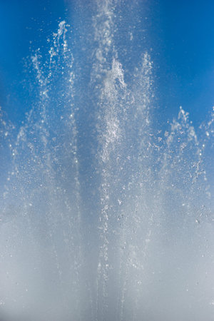 Cascade of water on bright blue sky
