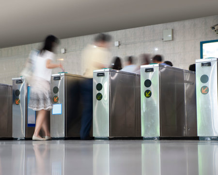 People in blurred motion entering subway station