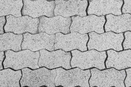 Background with white paving stones on sidewalkの写真素材