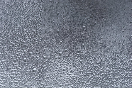 Background with drops of water on glass window