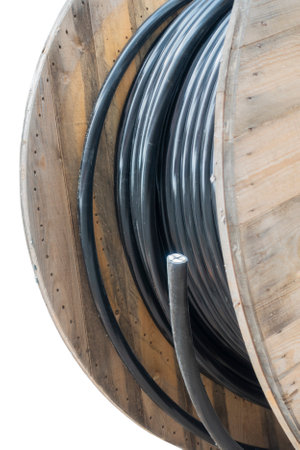 Close-up of wooden industrial cable reel, isolated in whiteの写真素材