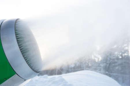 Close-up of nozzles of green snow cannon in ski slope. Copy space.の写真素材